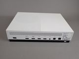 a close up of a white computer on a gray surface