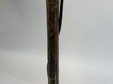 an old fashioned table lamp that is sitting on a table