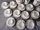 a lot of cups and saucers on a table