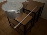 pots and pans are sitting on a table in a room