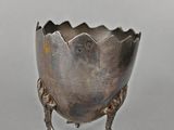 silver plated footed bowl with feet and feet on a stand