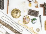 many different types of jewelry on a white surface