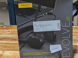 a box of headphones sitting on a wooden table