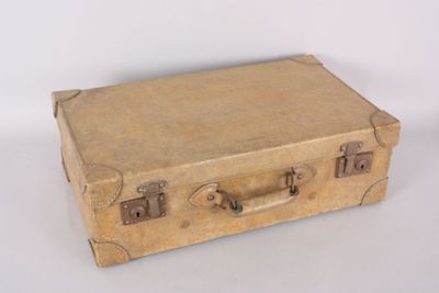 an old suitcase that is sitting on a white surface