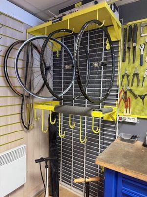 a bike hanging on a rack in a garage