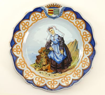 a plate with a picture of a woman and a lion on it