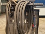 a machine that is sitting in a room with hoses