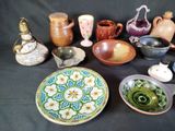 many different types of pottery on the table
