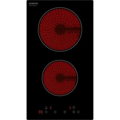 un gros plan sur une plaque de cuisson noire et rouge équipée de deux feux