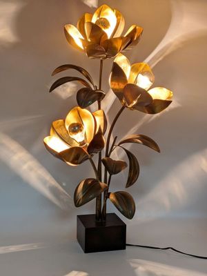 a lamp that has a bunch of flowers on it