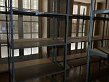 a room with a lot of shelvings in it