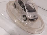 a toy car that is on display in a glass case