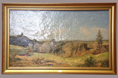 an oil painting of a landscape in a gold frame on a wall