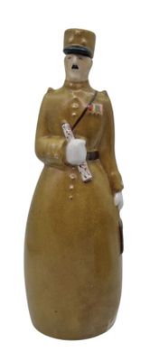 a ceramic figurine of a soldier with a bird on his shoulder