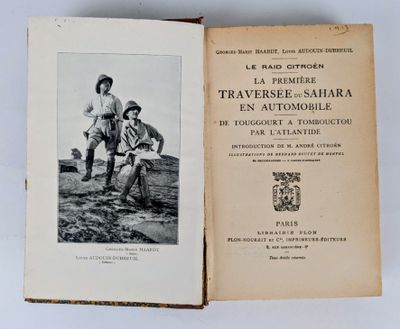 an old book with a black and white photo of two children