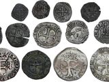 une image représentant une collection de pièces de monnaie anciennes sur fond blanc