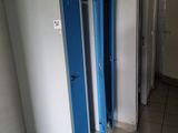 two blue lockers in the hallway of a building