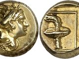 a gold coin with an image of a man holding a bowl
