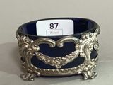 an ornate silver and blue bowl with a price tag on it
