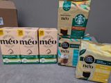 several boxes of coffee are sitting on a table next to a box of coffee