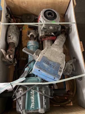 a box full of tools that are sitting on the floor
