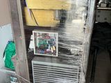 a refrigerator that is wrapped in plastic and sitting on the floor