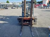 a forklift that is parked in a parking lot
