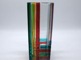 an image of a multicolored glass vase on a white surface