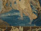 a tapestry with a picture of a woman and a dog