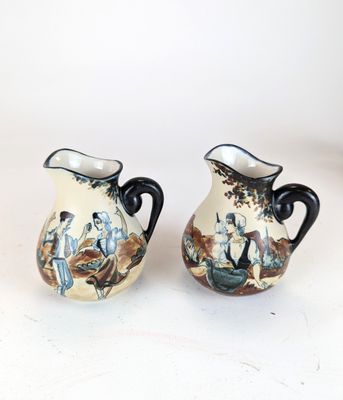 two vases that are sitting on a table