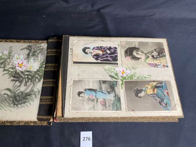 two books with pictures of women and flowers on them on a table