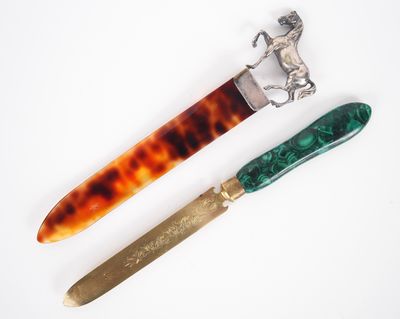 a knife and a knife holder sitting next to each other