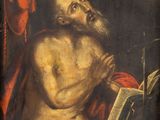 a painting of a man reading a book in a dark room