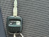 a car key that is attached to a car seat belt