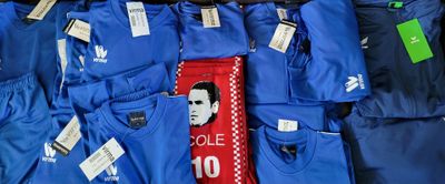 a lot of blue shirts that are on display