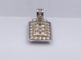 a silver and gold square pendant with diamonds on a white background