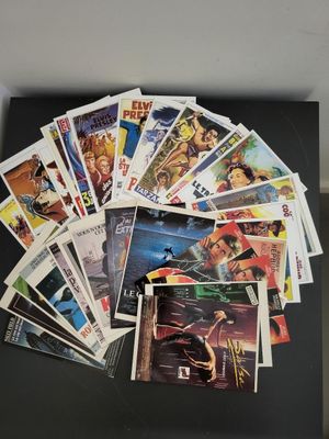 a bunch of comic books sitting on top of a black table