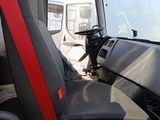a view of the inside of a truck from the driver ' s seat