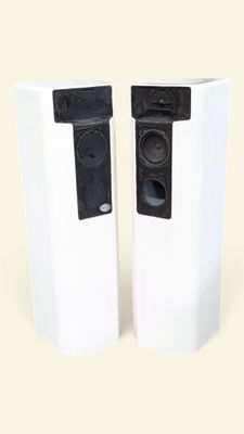 two speakers sitting next to each other on a table