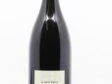 a close up of a bottle of wine on a white background