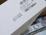 a white box with a barcode on it sitting on top of a shopping cart