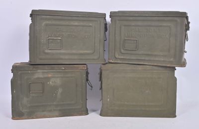 four army green boxes stacked on top of each other on a white surface