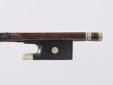 an image of a violin bow with a piece of wood on it