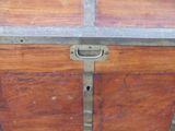a wooden chest with a metal latch on it
