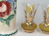 two vases sitting next to each other on a table