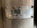 a close up of a metal plate on a machine