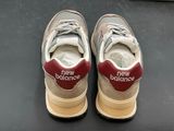 sneakers with new balance written on them on a black surface
