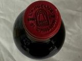a bottle of wine that is sitting on a table