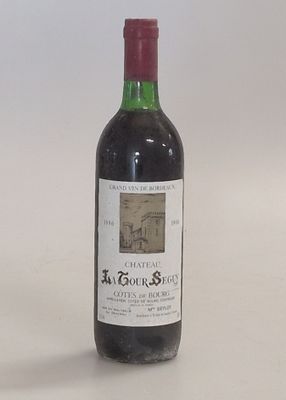 a bottle of wine that is sitting on a table
