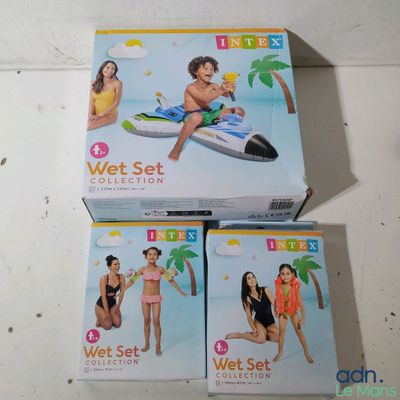 two boxes of wet set toys sitting on top of a table